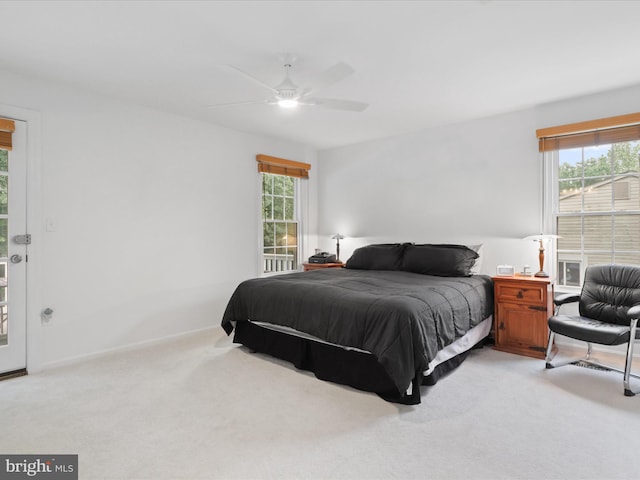 5281 Navaho Dr, Alexandria, VA 22312 - bedroom featuring light carpet, multiple windows, a ceiling fan, and access to outside