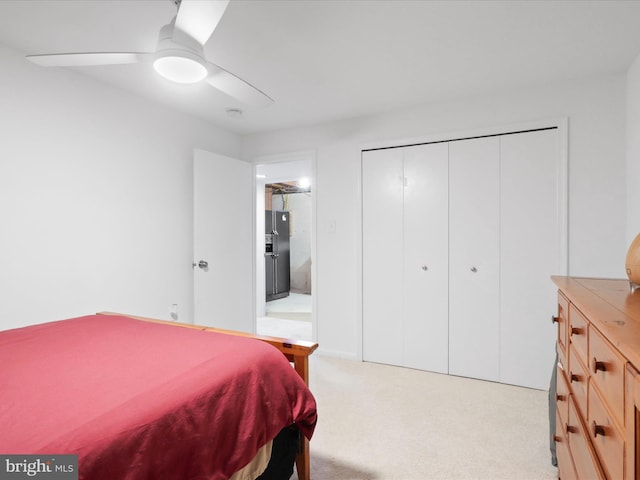 5281 Navaho Dr, Alexandria, VA 22312 - bedroom with black fridge, light carpet, ceiling fan, and a closet