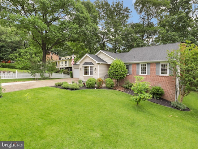 5281 Navaho Dr, Alexandria, VA 22312 - view of front of property with brick siding, concrete driveway, and a garage