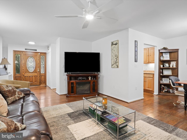 5281 Navaho Dr, Alexandria, VA 22312 - living area with wood-type flooring, a ceiling fan, and baseboards