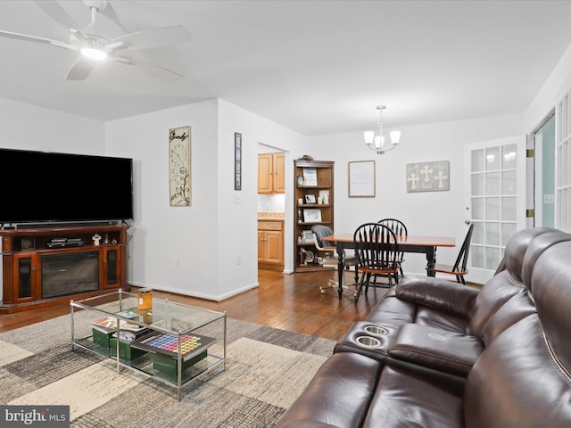 5281 Navaho Dr, Alexandria, VA 22312 - living area with wood finished floors, a chandelier, a ceiling fan, and baseboards