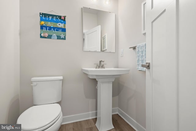 30366 Indigo Way, Georgetown, DE 19947 - half bathroom with wood finished floors, baseboards, and toilet