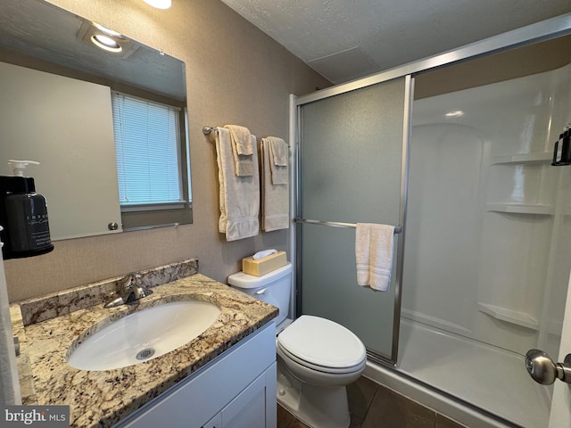 1 Read Ave Unit 110B, Dewey Beach, DE 19971 - bathroom with a stall shower, vanity, tile patterned flooring, and a textured ceiling