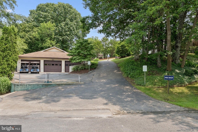 803 Coxswain Way Unit 107, Annapolis, MD 21401 - view of property's community featuring a garage and asphalt driveway