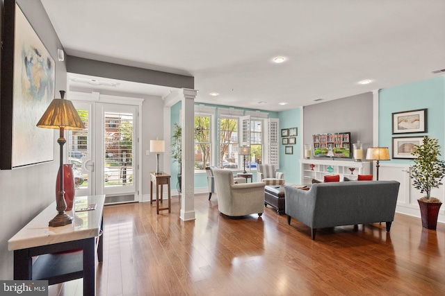 1418 N Rhodes St Unit B105, Arlington, VA 22209 - living area featuring wood finished floors, recessed lighting, and decorative columns