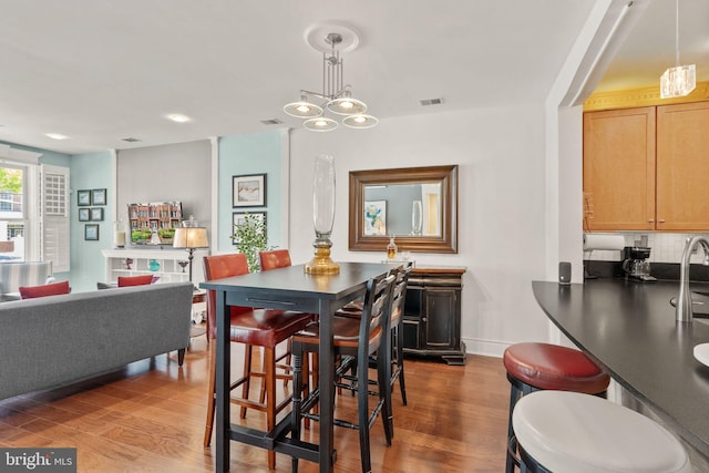 1418 N Rhodes St Unit B105, Arlington, VA 22209 - dining area featuring dark wood-style flooring