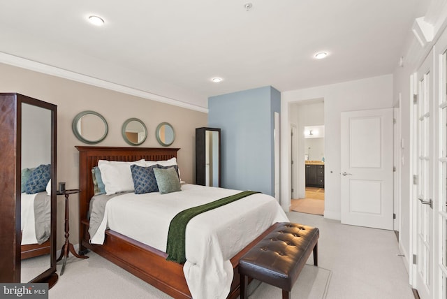 1418 N Rhodes St Unit B105, Arlington, VA 22209 - bedroom featuring light carpet, connected bathroom, and recessed lighting