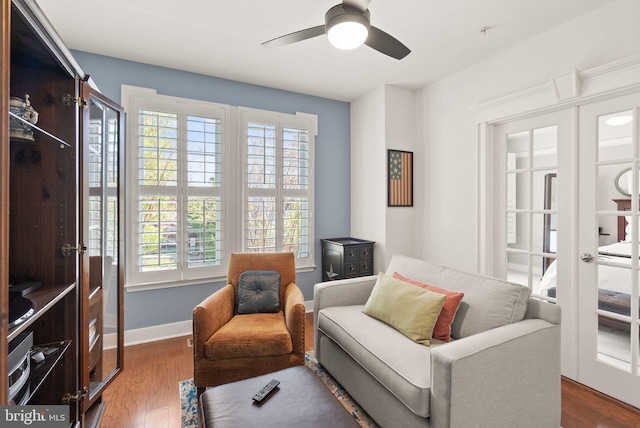 1418 N Rhodes St Unit B105, Arlington, VA 22209 - living area featuring wood finished floors, ceiling fan, french doors, and baseboards