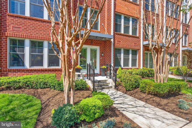 1418 N Rhodes St Unit B105, Arlington, VA 22209 - view of exterior entry featuring brick siding