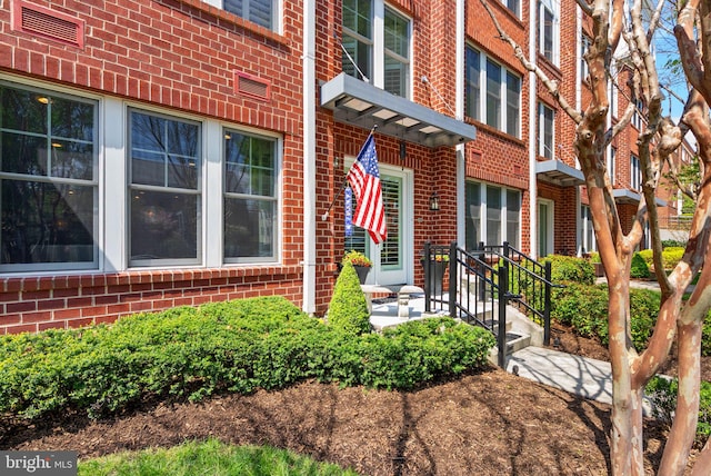 1418 N Rhodes St Unit B105, Arlington, VA 22209 - doorway to property featuring brick siding