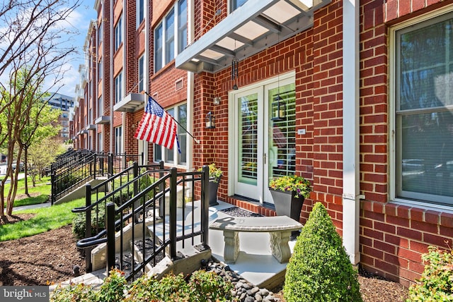 1418 N Rhodes St Unit B105, Arlington, VA 22209 - view of exterior entry featuring brick siding