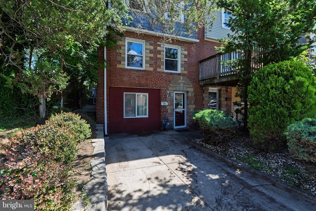 view of property with brick siding