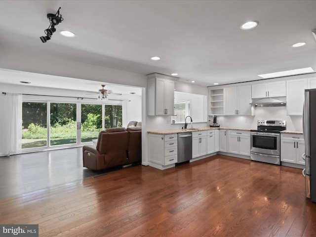 kitchen with stainless steel appliances, under cabinet range hood, open floor plan, dark wood-style floors, and open shelves