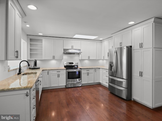 kitchen featuring appliances with stainless steel finishes, a sink, open shelves, recessed lighting, and under cabinet range hood