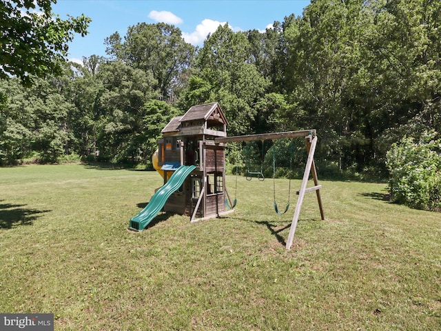 view of jungle gym featuring a lawn