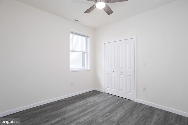 1207 Race St, Cambridge, MD 21613 - unfurnished bedroom featuring dark wood-style flooring, a closet, baseboards, and ceiling fan