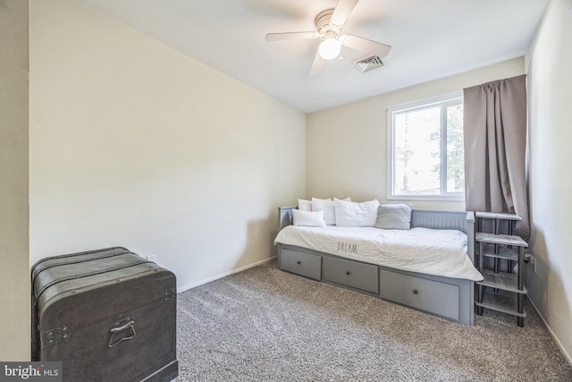 carpeted bedroom with baseboards and a ceiling fan