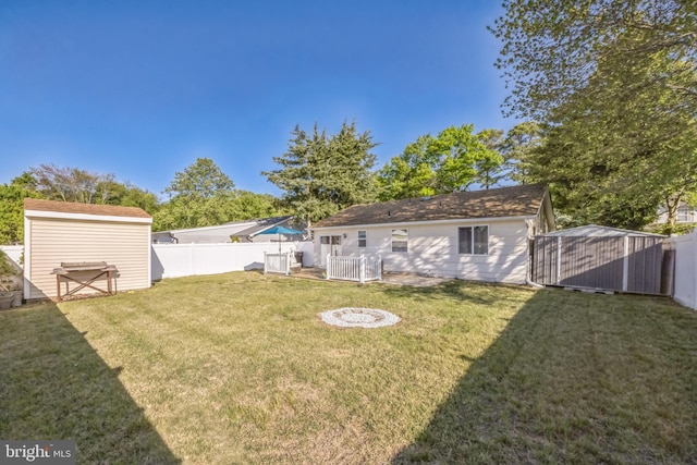 view of yard with a storage shed and an outdoor structure