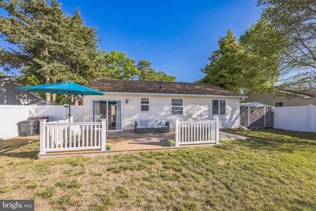 rear view of property with an outdoor hangout area, a deck, and a shed