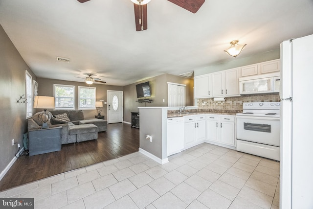 kitchen featuring white appliances, ceiling fan, baseboards, light tile patterned flooring, and open floor plan
