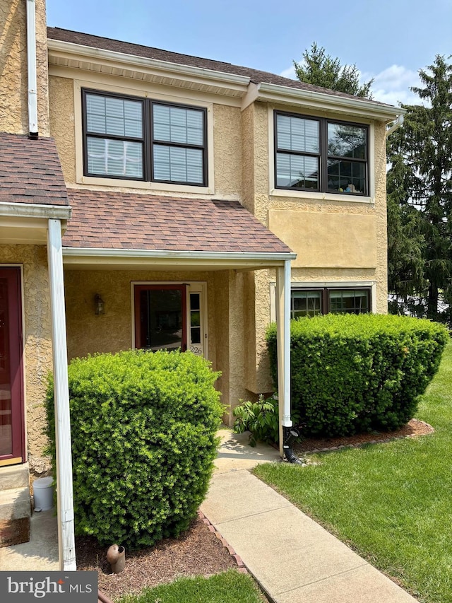226 Smallwood Ct, West Chester, PA 19380 - view of exterior entry featuring stucco siding and a shingled roof