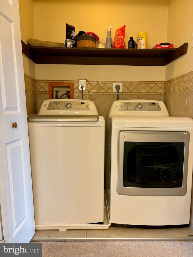 226 Smallwood Ct, West Chester, PA 19380 - laundry room with washing machine and dryer, tile patterned floors, and tile walls