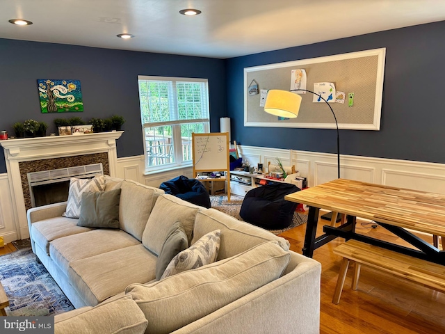 226 Smallwood Ct, West Chester, PA 19380 - living area with wood finished floors, wainscoting, a decorative wall, recessed lighting, and a premium fireplace