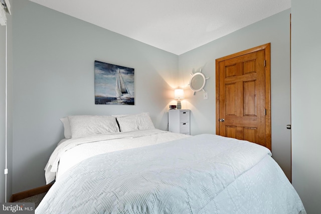 bedroom featuring baseboards