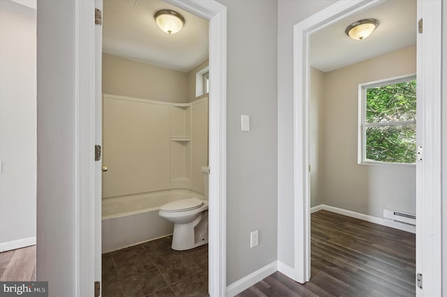 3238 Jasper St, Philadelphia, PA 19134 - full bath featuring baseboard heating, toilet, baseboards, shower / washtub combination, and wood finished floors