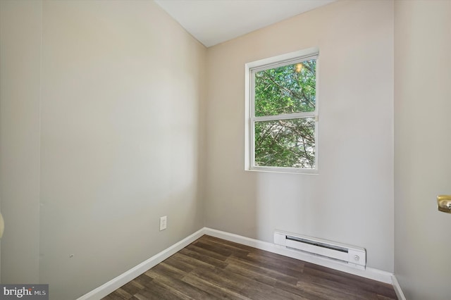3238 Jasper St, Philadelphia, PA 19134 - spare room with a baseboard radiator, baseboards, and dark wood-style flooring