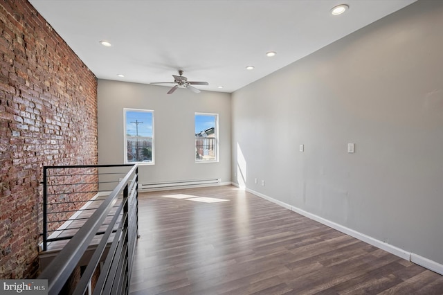 3238 Jasper St, Philadelphia, PA 19134 - spare room with a baseboard heating unit, wood finished floors, recessed lighting, a ceiling fan, and baseboards