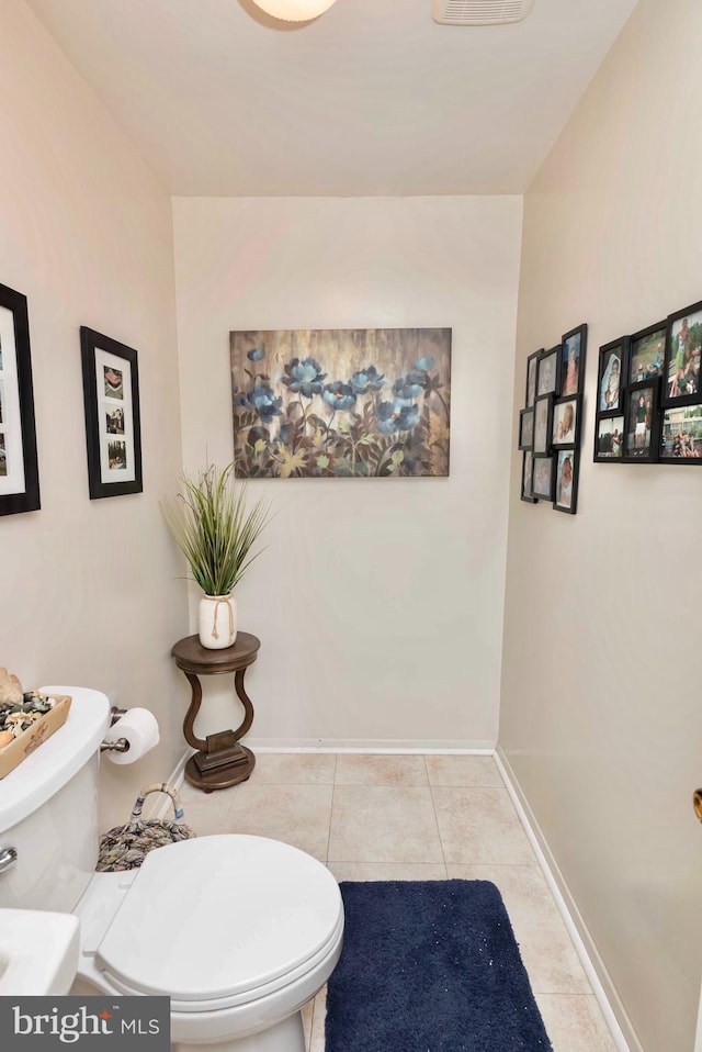 9520 Perry Brook Ct, Nottingham, MD 21236 - half bathroom with toilet, tile patterned floors, and baseboards
