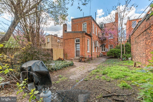 view of side of home featuring brick siding
