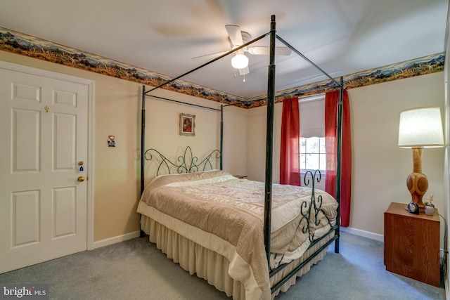 bedroom with light carpet, baseboards, and a ceiling fan
