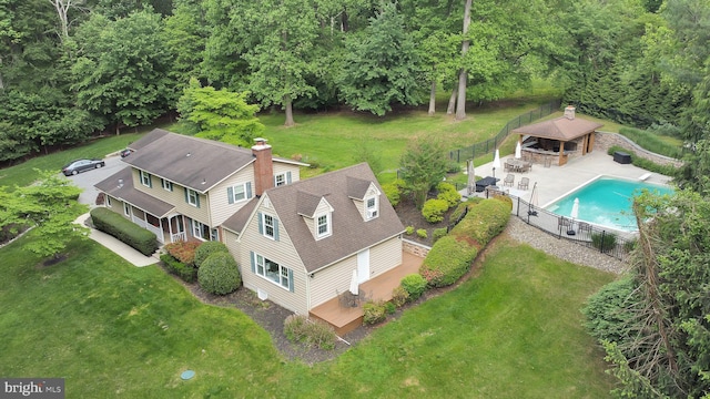 view of subject property featuring a pool area