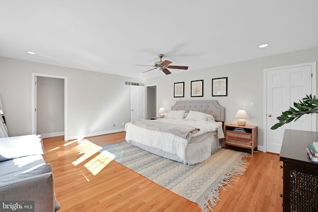 bedroom featuring light wood-style flooring, baseboards, recessed lighting, and a ceiling fan