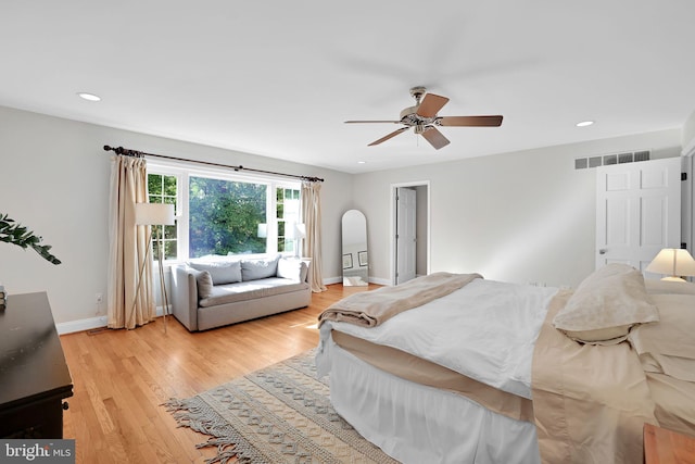 bedroom featuring light wood-style floors, recessed lighting, baseboards, and ceiling fan