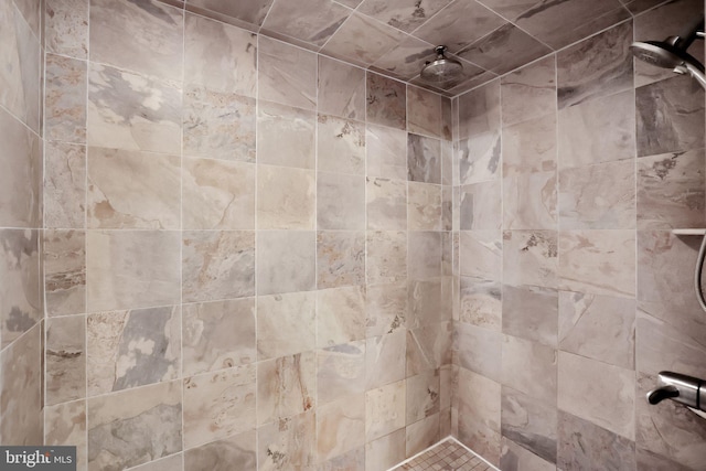 bathroom with a tile shower