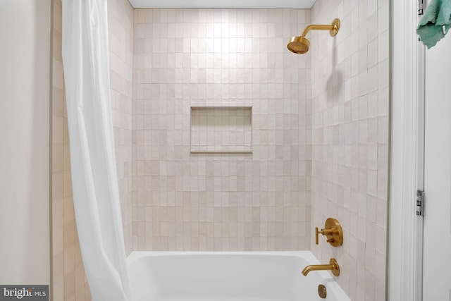 bathroom featuring shower / bath combination with curtain