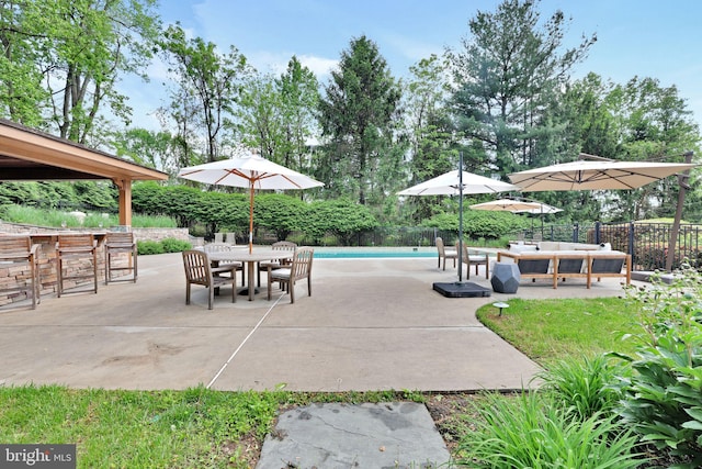 view of patio featuring fence, an outdoor living space, and outdoor dining area