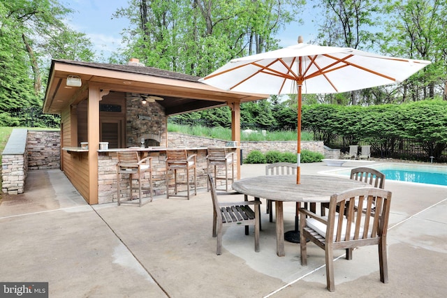 view of patio / terrace with a gazebo, a ceiling fan, and fence