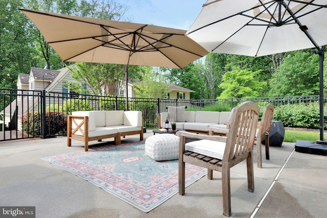view of patio / terrace with an outdoor living space and fence
