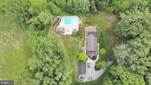 aerial view of property and surrounding area featuring a pool area