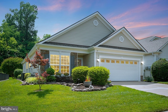24 Smithfield Way, Fredericksburg, VA 22406 - view of front of house with stone siding, concrete driveway, a lawn, a shingled roof, and an attached garage