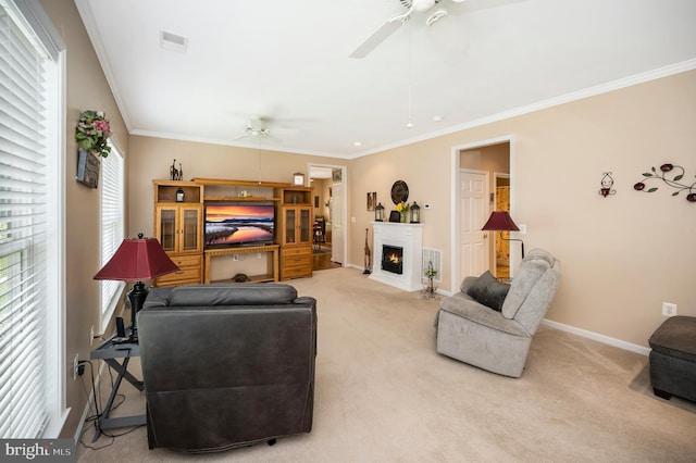 24 Smithfield Way, Fredericksburg, VA 22406 - living area featuring ceiling fan, ornamental molding, light carpet, plenty of natural light, and a fireplace with flush hearth