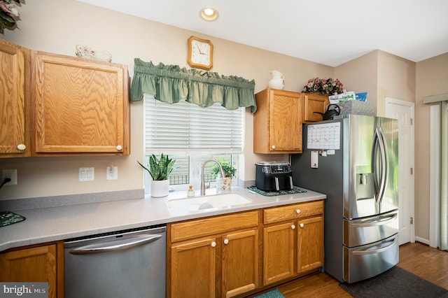 24 Smithfield Way, Fredericksburg, VA 22406 - kitchen featuring stainless steel appliances, wood finished floors, light countertops, brown cabinets, and recessed lighting