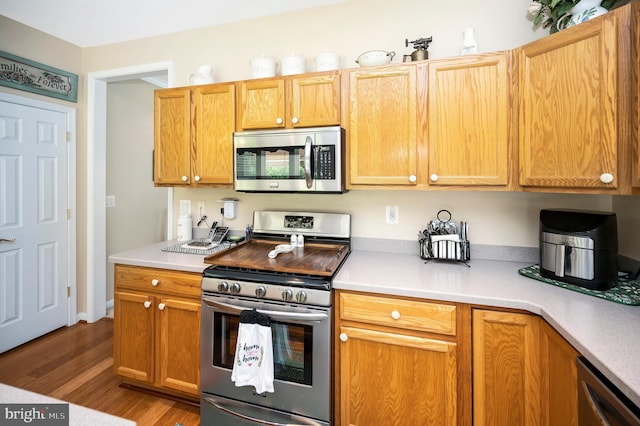 24 Smithfield Way, Fredericksburg, VA 22406 - kitchen with appliances with stainless steel finishes, wood finished floors, and light countertops