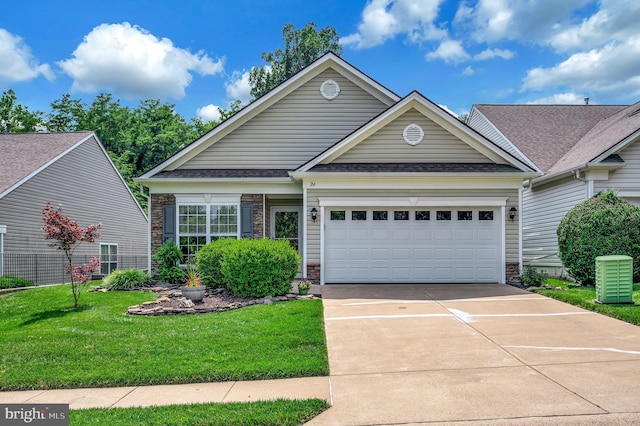 24 Smithfield Way, Fredericksburg, VA 22406 - view of front of home featuring driveway, a garage, a front yard, a shingled roof, and stone siding