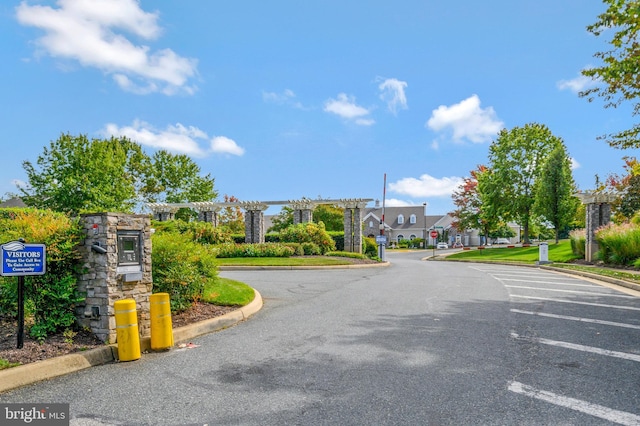 24 Smithfield Way, Fredericksburg, VA 22406 - view of asphalt road with curbs, a residential view, and traffic signs