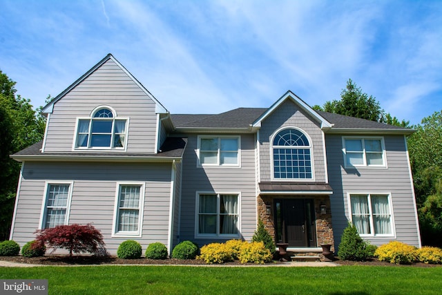 view of front of home with a front yard